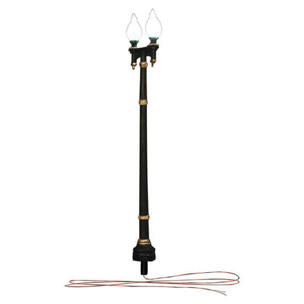 Wooden pole double lamp post street light for HO scale model train layouts with warm white LED lights and wiring.