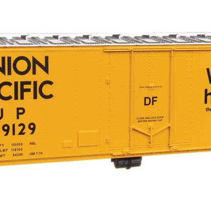 Walthers Mainline HO Scale Union Pacific 50' boxcar model #499129, featuring vibrant yellow paint and detailed logos.