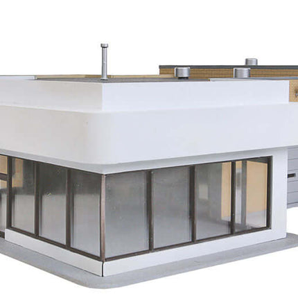 Walthers 933-3483 Ford Dealership kit for HO scale model layouts, featuring modern design and showroom windows.