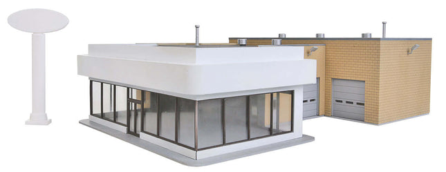 Walthers 933-3483 Ford Dealership kit for HO scale model layouts, featuring modern design and showroom windows.
