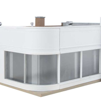 Walthers Vintage Ford Auto Dealer kit model for HO scale train layouts, showcasing classic architectural design.