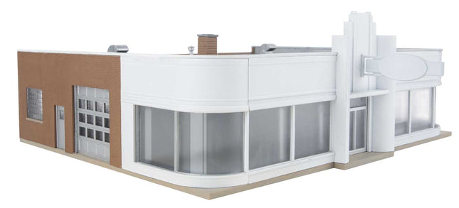 Walthers Vintage Ford Auto Dealer kit model for HO scale train layouts, showcasing classic architectural design.