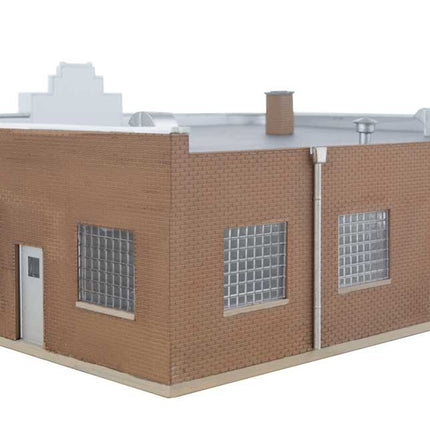 Walthers Vintage Ford Auto Dealer building kit for HO scale model train layouts, featuring retro design and realistic colors.