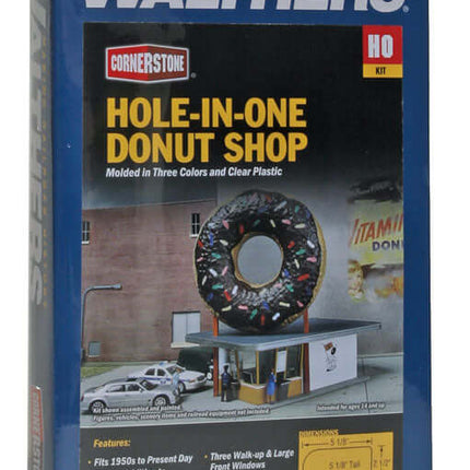 Walthers Cornerstone Hole-In-One Donut Shop kit for HO scale, featuring a colorful giant donut sign and detailed building.