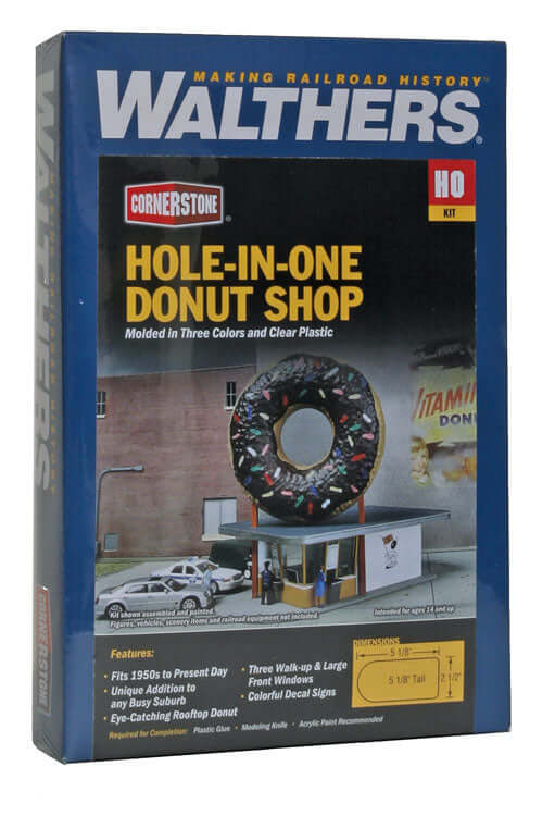 Walthers Cornerstone Hole-In-One Donut Shop kit for HO scale, featuring a colorful giant donut sign and detailed building.