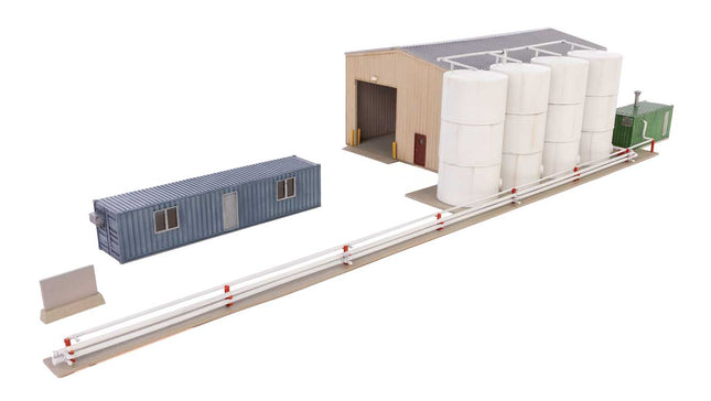 Walthers Cornerstone Corn Syrup Transfer Facility kit with tanks, storage building, and transfer pipes for HO scale model railroads.