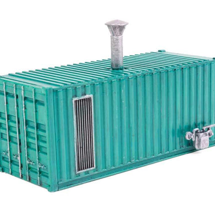 HO scale boiler house building kit resembling a shipping container, molded in green plastic with a chimney.