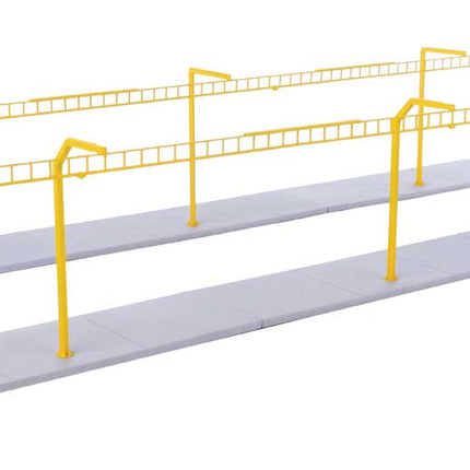 Walthers Cornerstone Transload Facility Safety System model kit with yellow safety poles and gray base for HO scale railway layout.