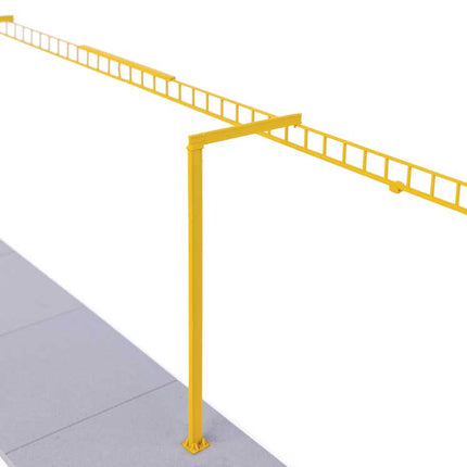 Yellow safety system crane for transload facility building kit in HO scale model railway.