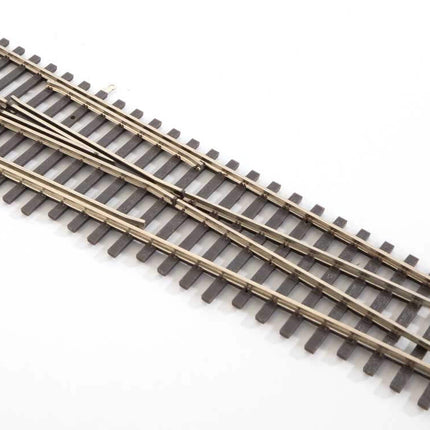 WalthersTrack Code 83 Nickel Silver left hand turnout for HO scale model railroads, featuring realistic ties and rail details.