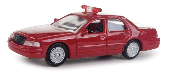 Walthers SceneMaster HO scale Ford Crown Victoria Police Interceptor model in red with fire markings