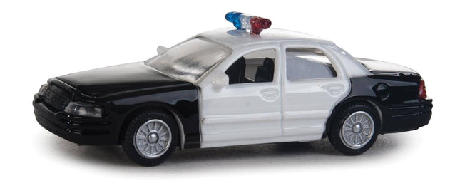 Walthers HO Ford Crown Victoria Police Interceptor model, black and white patrol car with light bar, 1:87 scale.