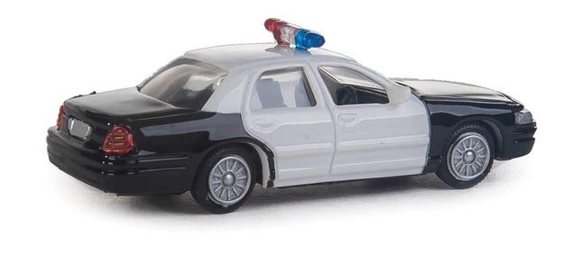 Walthers HO scale Ford Crown Victoria Police Interceptor model car, black and white, with lights on top.