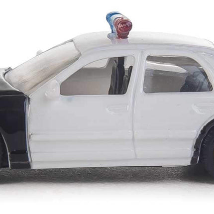 Walthers SceneMaster HO scale Ford Crown Victoria Police Interceptor, black and white patrol car model.
