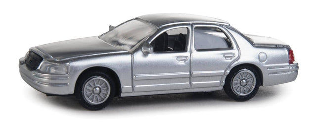 Walthers SceneMaster unmarked Ford Crown Victoria Police Interceptor in silver, HO scale model vehicle, fully assembled.