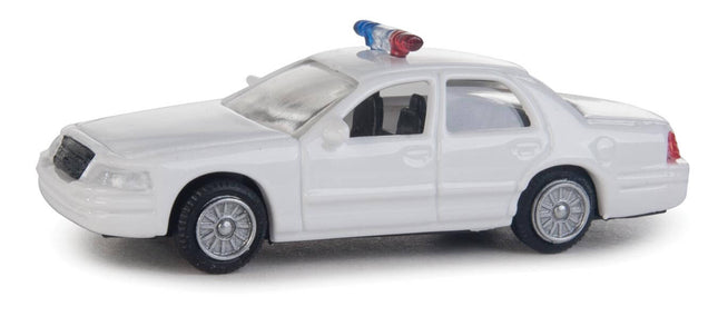 Walthers HO scale Ford Crown Victoria police interceptor model, all-white patrol car with rooftop lightbar.