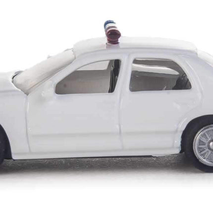 Walthers SceneMaster HO scale Ford Crown Victoria Police Interceptor all-white patrol car model with lightbar