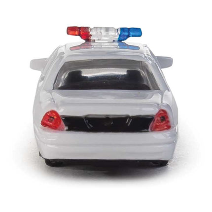 Walthers HO Scale all-white Ford Crown Victoria Police Interceptor model with lightbar, ideal for city layouts.