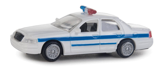 Walthers HO Ford Crown Victoria Police Interceptor model in white with blue stripe, fully assembled with rooftop lightbar.