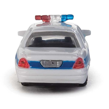 Walthers HO Ford Crown Victoria Police Interceptor in white with blue stripe, rear view with rooftop lightbar.