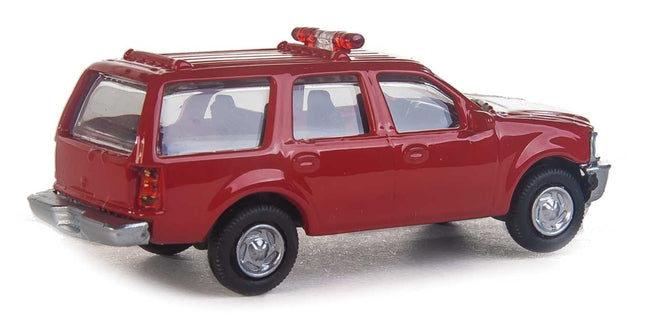 Walthers SceneMaster Ford Expedition SSV, red fire command vehicle, HO scale with lightbar and detailed interior.