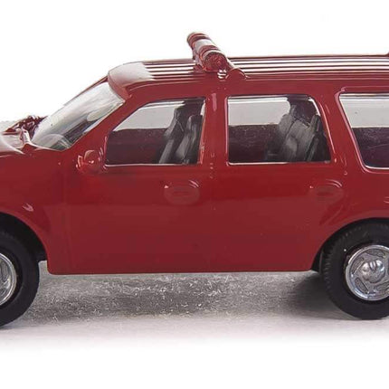 Walthers SceneMaster HO Scale Ford Expedition Special Service Vehicle in red with fire command markings, detailed interior.
