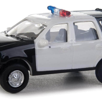 Walthers SceneMaster HO scale Ford Expedition Special Service Vehicle in black and white with police lights