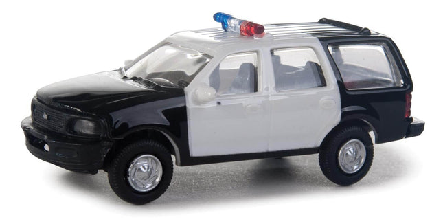 Walthers SceneMaster HO scale Ford Expedition Special Service Vehicle in black and white with police lights