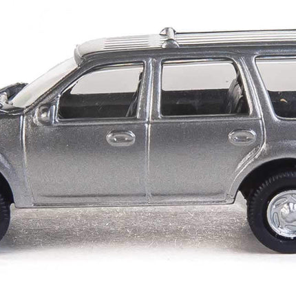 Silver Ford Expedition SSV toy vehicle in HO scale, featuring detailed body and realistic wheels.