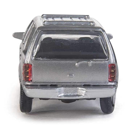 Rear view of unmarked silver Ford Expedition SSV model from Walthers SceneMaster, HO scale, detailed and ready for layout.