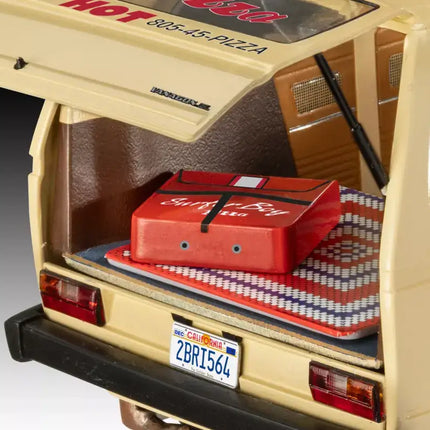 Detailed view of Revell 1:25 scale VW Vanagon's interior showcasing pizza delivery bag and crochet blanket.