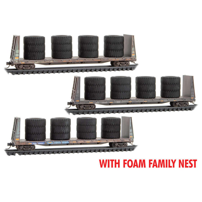 Micro Trains 993 02 247 N Scale bulkhead flatcar 3-pack with large tire load in foam case, ideal for collectors and model train enthusiasts.