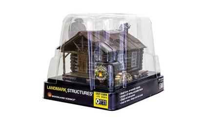 Woodland Scenics 5875 Cozy Cabin O Scale in packaging, featuring assembled and hand-painted details with Just Plug® Lighting System.