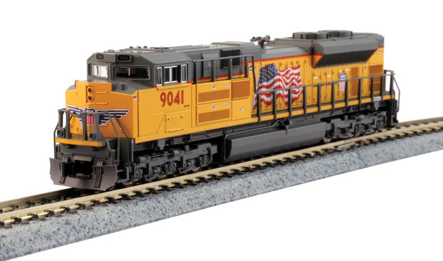 Kato 1768529 | EMD SD70ACe with Nose Headlight - Standard DC - Union Pacific #8983 (Armour Yellow, gray, United States Flag) | N Scale