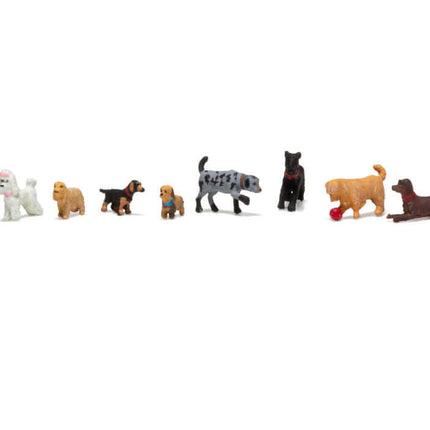 Woodland Scenics HO Scale assembled figures of 9 dogs and 1 black cat, perfect for miniature layouts and scenes.