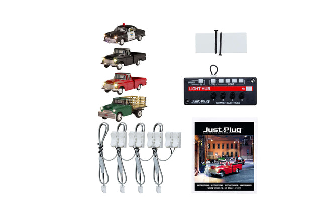 Woodland Scenics Just Plug Value Pack with HO Scale work vehicles, light hub, and accessories for dynamic layouts.