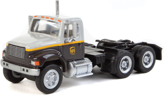 Walthers SceneMaster 949-11186 | International(R) 4900 Dual-Axle Semi Tractor Only - Assembled - UPS Freight(SM) (gray, gold, brown) | HO Scale - Squeaky's Trains