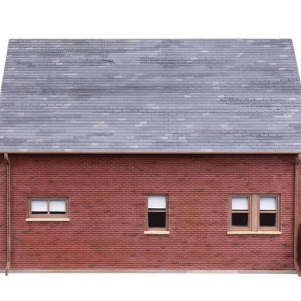 Walthers Cornerstone 933-4250 | Tudor House – Plastic Building Kit | HO Scale rear view showing realistic brick texture and gables.