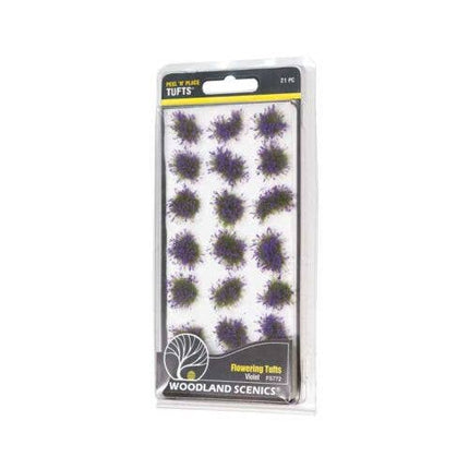Packaged product of Woodland Scenics Flowering Tufts with purple flowers on a white background