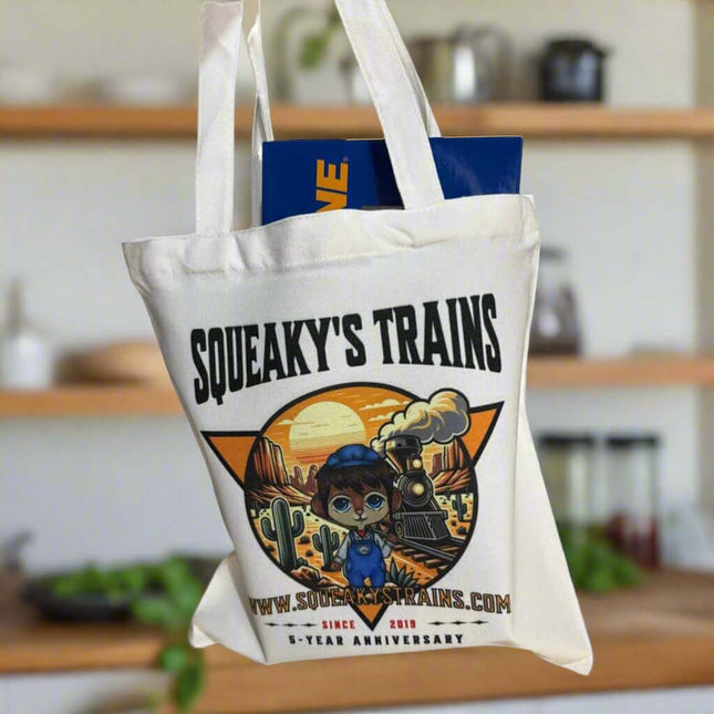 Limited edition Squeaky's Trains tote bag celebrating 5-year anniversary with desert railroad design.