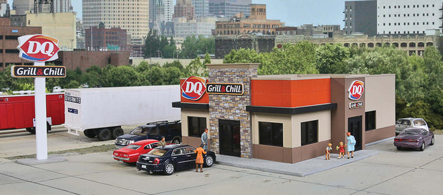 Walthers Cornerstone 933-3485 | DQ Grill & Chill Restaurant – Plastic Building Kit | HO Scale model of DQ restaurant with cars and figures.